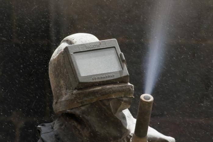 Équipe de Çadécaptout partageant des conseils pour le traitement de surface à Mézidon Vallée d’Auge